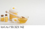 arrangement with honey salts white background. Стоковое фото, агентство Ingram Publishing / Фотобанк Лори
