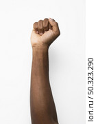 black person holding fist up. Стоковое фото, агентство Ingram Publishing / Фотобанк Лори