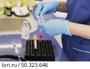 close up doctor with small tubes. Стоковое фото, агентство Ingram Publishing / Фотобанк Лори
