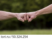 fist bump welcome gesture. Стоковое фото, агентство Ingram Publishing / Фотобанк Лори