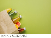 flatlay paper bag with fruit juices. Стоковое фото, агентство Ingram Publishing / Фотобанк Лори