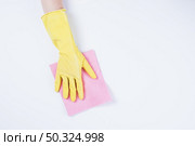 janitor cleaning with duster white background. Стоковое фото, агентство Ingram Publishing / Фотобанк Лори