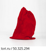 red sack gifts standing white background . Resolution and high quality beautiful photo. red sack gifts standing white background . High quality and resolution beautiful photo concept. Стоковое фото, агентство Ingram Publishing / Фотобанк Лори
