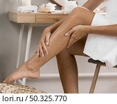 woman s legs with cream. Resolution and high quality beautiful photo. woman s legs with cream. High quality and resolution beautiful photo concept. Стоковое фото, агентство Ingram Publishing / Фотобанк Лори