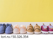 baby concept with different pairs shoes. Resolution and high quality beautiful photo. baby concept with different pairs shoes. High quality beautiful photo concept. Стоковое фото, агентство Ingram Publishing / Фотобанк Лори
