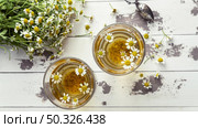 chamomile tea cups top view 3. Resolution and high quality beautiful photo. chamomile tea cups top view 3. High quality beautiful photo concept. Стоковое фото, агентство Ingram Publishing / Фотобанк Лори