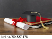 education day arrangement with graduation cap. High resolution photo. education day arrangement with graduation cap. High quality photo. Стоковое фото, агентство Ingram Publishing / Фотобанк Лори