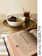 ramadan concept with open quran dates. High resolution photo. ramadan concept with open quran dates. High quality photo. Стоковое фото, агентство Ingram Publishing / Фотобанк Лори
