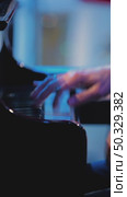 A man's hands touch the keys of a piano and play a jazz tune. A pianist plays chords, creating music on a piano in a dark room. Close-up of the musician's fingers. Стоковое видео, видеограф Воловодов Владимир / Фотобанк Лори