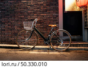 old bicycle with brown details. High resolution photo. old bicycle with brown details. High quality photo. Стоковое фото, агентство Ingram Publishing / Фотобанк Лори