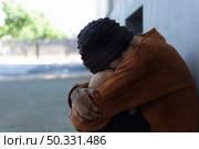 homeless man sitting streets. High resolution photo. homeless man sitting streets. High quality photo. Стоковое фото, агентство Ingram Publishing / Фотобанк Лори