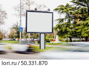 blurred vehicle passing by blank billboard road. High resolution photo. blurred vehicle passing by blank billboard road. High quality photo. Стоковое фото, агентство Ingram Publishing / Фотобанк Лори