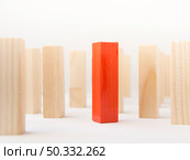 OLYMPUS DIGITAL CAMERA. High resolution photo. red wooden brick surrounded by normal ones close up. High quality photo. Стоковое фото, агентство Ingram Publishing / Фотобанк Лори