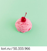pink ice cream ball with cherry. Стоковое фото, агентство Ingram Publishing / Фотобанк Лори