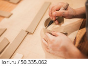 female potter s hand engraving clay with tools wooden table. Стоковое фото, агентство Ingram Publishing / Фотобанк Лори