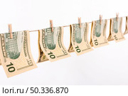 side view banknotes hanging clothesline. Стоковое фото, агентство Ingram Publishing / Фотобанк Лори