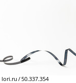 curled film stripes isolated white background. Стоковое фото, агентство Ingram Publishing / Фотобанк Лори