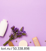 flat lay frame with white bottle lilac flower. Стоковое фото, агентство Ingram Publishing / Фотобанк Лори