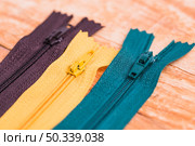 line three different zips. Стоковое фото, агентство Ingram Publishing / Фотобанк Лори