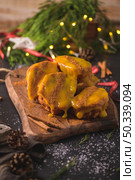 Traditional Christmas Rabanadas with egg yolk cream and cinnamon. Spanish Torrijas close up on the countertop. Стоковое фото, агентство Ingram Publishing / Фотобанк Лори
