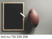 american football ball blackboard. Стоковое фото, агентство Ingram Publishing / Фотобанк Лори