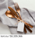 arrangement elegant tableware with empty tag. Стоковое фото, агентство Ingram Publishing / Фотобанк Лори