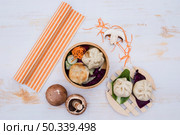 chinese steamed dimsum bamboo containers traditional cuisine white wooden table. Стоковое фото, агентство Ingram Publishing / Фотобанк Лори