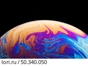 gradient saturated colorful soap bubble black background. Стоковое фото, агентство Ingram Publishing / Фотобанк Лори