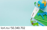 top view animal figurines with planet earth calendar animal day. Стоковое фото, агентство Ingram Publishing / Фотобанк Лори