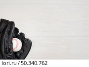 top view glove with baseball copy space. Стоковое фото, агентство Ingram Publishing / Фотобанк Лори