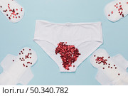 top view knickers with red sequins sanitary napkins. Стоковое фото, агентство Ingram Publishing / Фотобанк Лори