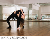 young female dancer practising dance studio. Стоковое фото, агентство Ingram Publishing / Фотобанк Лори