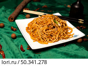 Fresh Lo Mein Noodles Presented on White Plate in Chinese Restaurant. Стоковое фото, фотограф Aleksandr Golubev / Фотобанк Лори