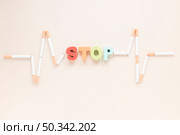 top view colorful word with cigarettes. Стоковое фото, агентство Ingram Publishing / Фотобанк Лори