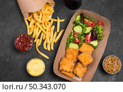 flat lay fried chicken nuggets with salad french fries. Стоковое фото, агентство Ingram Publishing / Фотобанк Лори