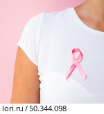 OLYMPUS DIGITAL CAMERA. close up person with awareness ribbon. Стоковое фото, агентство Ingram Publishing / Фотобанк Лори