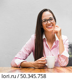 medium shot business woman with cup coffee. Стоковое фото, агентство Ingram Publishing / Фотобанк Лори