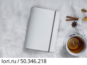 teatime with opened blank notebook. Стоковое фото, агентство Ingram Publishing / Фотобанк Лори