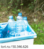 trashcan with plastic garbage outdoors. Стоковое фото, агентство Ingram Publishing / Фотобанк Лори
