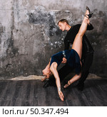 couple performing stance during passionate dance. Стоковое фото, агентство Ingram Publishing / Фотобанк Лори