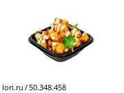 Savory Fried Bites Drizzled with Creamy Sauce, Garnished with Cilantro & Chili in Black Takeout Bowl. Perfect for menu or food delivery advert. Isolated. Стоковое фото, фотограф Данила Большаков / Фотобанк Лори