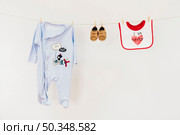 newborn concept with clothesline. Стоковое фото, агентство Ingram Publishing / Фотобанк Лори