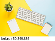 cozy workplace with keypad notebooks. Стоковое фото, агентство Ingram Publishing / Фотобанк Лори