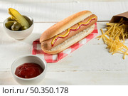 hot dog with cheese condiments. Стоковое фото, агентство Ingram Publishing / Фотобанк Лори