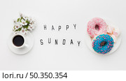 plate with delicious doughnuts flower. Стоковое фото, агентство Ingram Publishing / Фотобанк Лори