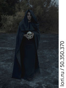 portrait male mage black clothes. Стоковое фото, агентство Ingram Publishing / Фотобанк Лори