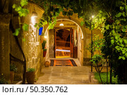 Courtyard in a hotel with a vineyard in Goreme. Courtyard in a hotel. Стоковое фото, агентство Ingram Publishing / Фотобанк Лори