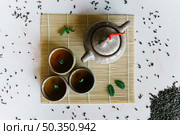 chinese japanese traditional teapot cup tea placemat. Стоковое фото, агентство Ingram Publishing / Фотобанк Лори