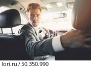 close up handsome man driving reverse. Стоковое фото, агентство Ingram Publishing / Фотобанк Лори