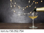 decoration with pouring champagne glass. Стоковое фото, агентство Ingram Publishing / Фотобанк Лори